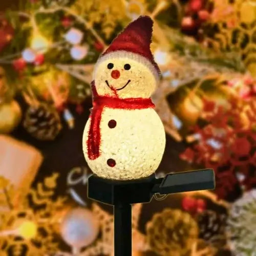 Imagem de luzes de Natal solar LED em formato de boneco de neve, ideais para decoração externa e resistentes à água.