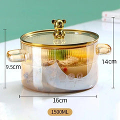 Panela de vidro temperado com tampa decorativa de urso, ideal para cozinhar com elegância e praticidade.